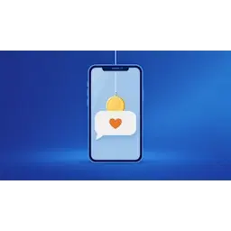Smartphone met een chatbericht met hartje en een gouden munt aan een vislijn als aas, als beeld voor datingfraude met crypto